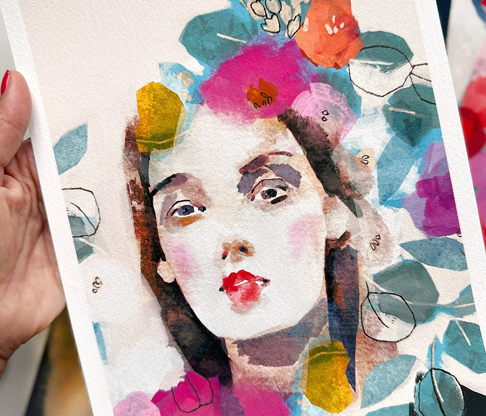 Colorful watercolor painting of a woman's face with flowers and leaves.